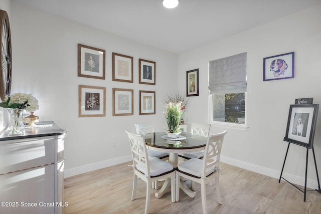 1401 Wyoming Dr SE, Palm Bay, FL 32909 - dining space featuring light wood-style floors and baseboards