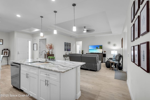1401 Wyoming Dr SE, Palm Bay, FL 32909 - kitchen featuring baseboards, a tray ceiling, a sink, and dishwasher