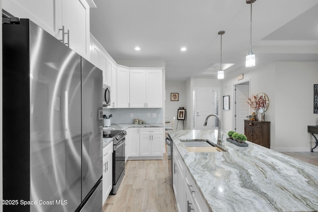 1401 Wyoming Dr SE, Palm Bay, FL 32909 - kitchen with a sink, appliances with stainless steel finishes, white cabinets, and backsplash