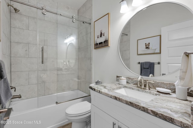 1401 Wyoming Dr SE, Palm Bay, FL 32909 - full bath with vanity, combined bath / shower with glass door, and toilet