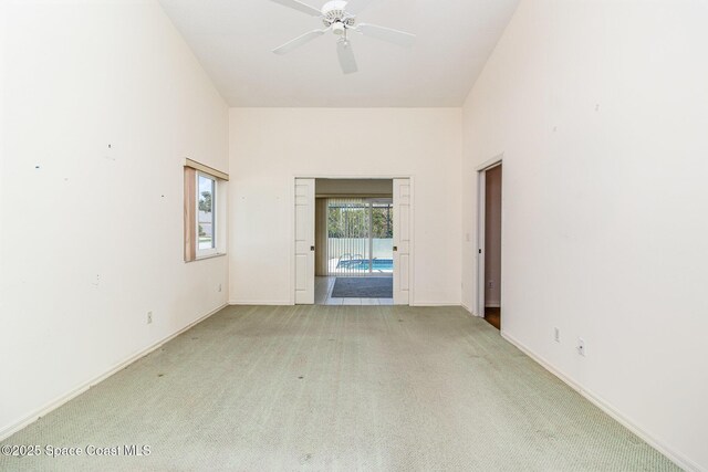1523 Tippicanoe Ct, Melbourne, FL 32940 - empty room featuring light colored carpet, baseboards, and a ceiling fan