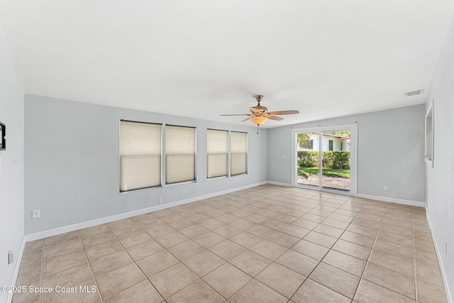 unfurnished room with visible vents, baseboards, ceiling fan, and light tile patterned floors