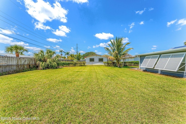 view of yard with a fenced backyard