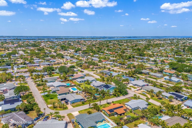 birds eye view of property with a residential view