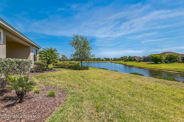 7447 Bluemink Ln, Melbourne, FL 32940 - view of grassy yard featuring a water view