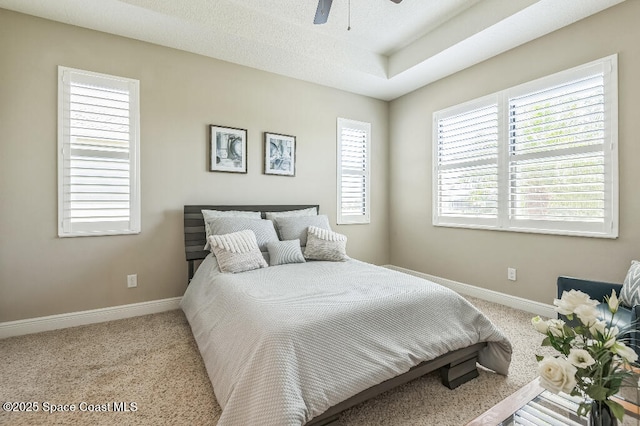 7447 Bluemink Ln, Melbourne, FL 32940 - carpeted bedroom with baseboards and a ceiling fan