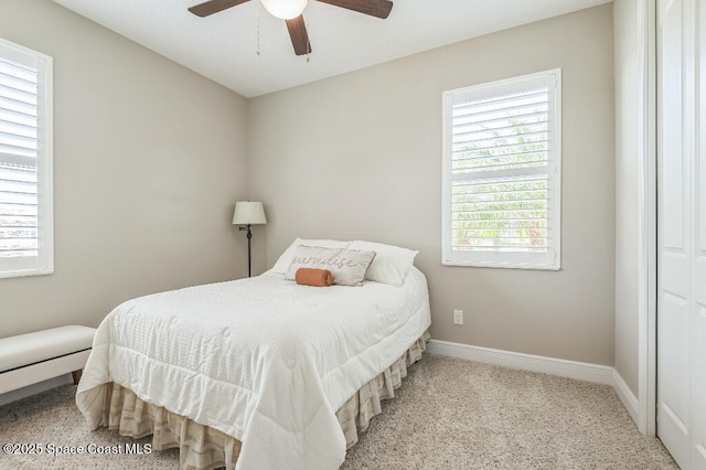7447 Bluemink Ln, Melbourne, FL 32940 - carpeted bedroom featuring baseboards and ceiling fan