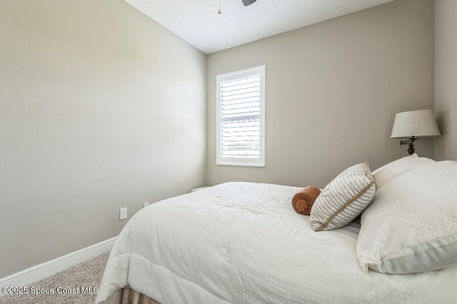 7447 Bluemink Ln, Melbourne, FL 32940 - carpeted bedroom with baseboards and a ceiling fan