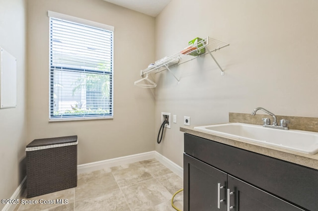 7447 Bluemink Ln, Melbourne, FL 32940 - washroom featuring hookup for an electric dryer, cabinet space, hookup for a washing machine, and baseboards