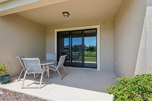 7447 Bluemink Ln, Melbourne, FL 32940 - view of patio featuring outdoor dining area