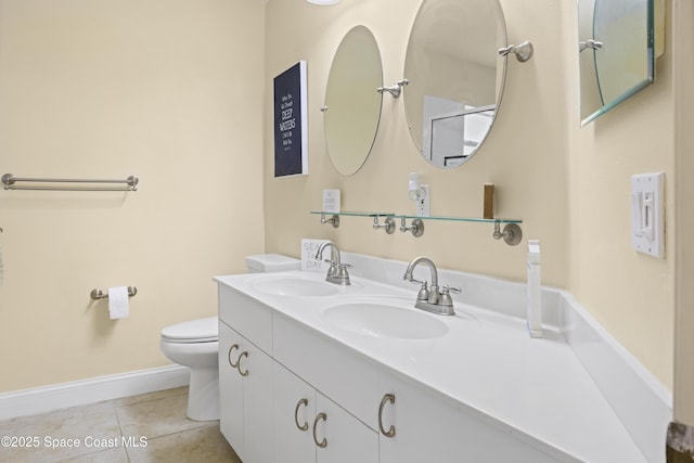 full bathroom featuring baseboards, toilet, tile patterned floors, and a sink