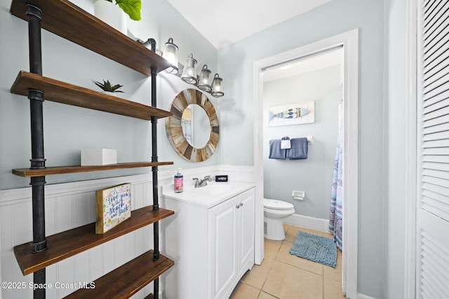 1380 Fiddler Ave, Merritt Island, FL 32952 - full bathroom featuring tile patterned floors, vanity, and toilet