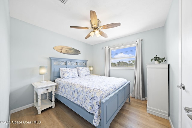 1380 Fiddler Ave, Merritt Island, FL 32952 - bedroom featuring baseboards, light wood finished floors, and ceiling fan