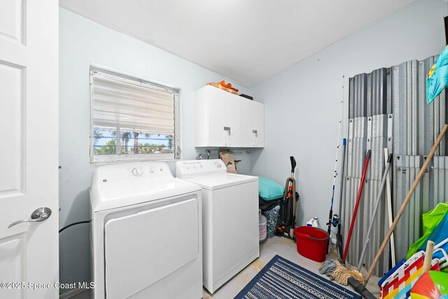 1380 Fiddler Ave, Merritt Island, FL 32952 - clothes washing area featuring separate washer and dryer and cabinet space