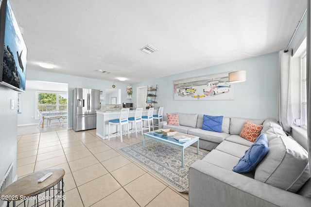 1380 Fiddler Ave, Merritt Island, FL 32952 - living room featuring visible vents, baseboards, and light tile patterned floors