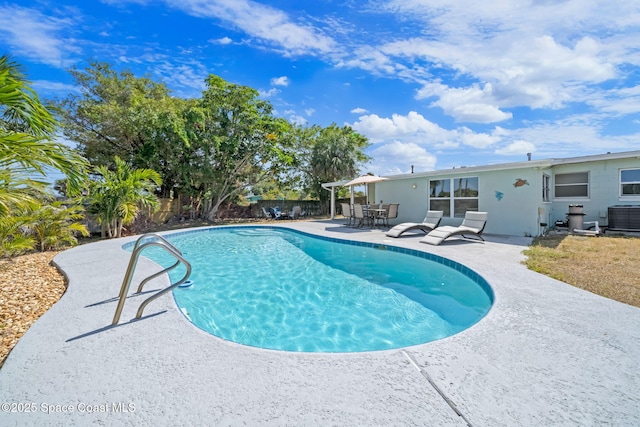1380 Fiddler Ave, Merritt Island, FL 32952 - view of swimming pool with a fenced backyard, a fenced in pool, a patio, and cooling unit