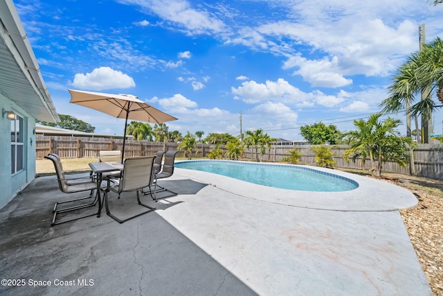 1380 Fiddler Ave, Merritt Island, FL 32952 - view of pool with a fenced in pool, a fenced backyard, outdoor dining space, and a patio