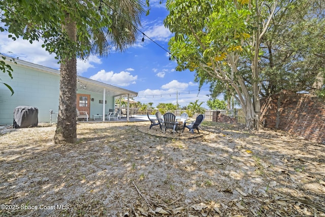 1380 Fiddler Ave, Merritt Island, FL 32952 - view of yard with fence and a patio