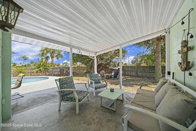 1380 Fiddler Ave, Merritt Island, FL 32952 - view of patio with outdoor lounge area, a fenced backyard, and a fenced in pool