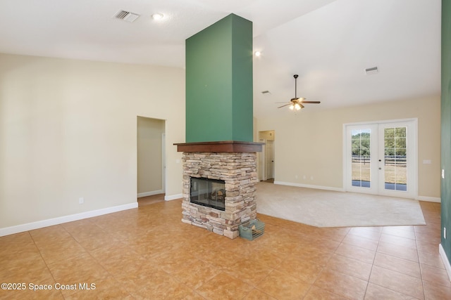 5635 N Tropical Trl, Merritt Island, FL 32953 - unfurnished living room with ceiling fan, a fireplace, high vaulted ceiling, french doors, and visible vents