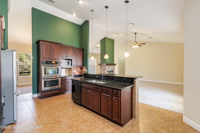5635 N Tropical Trl, Merritt Island, FL 32953 - kitchen with appliances with stainless steel finishes, a sink, high vaulted ceiling, a ceiling fan, and baseboards