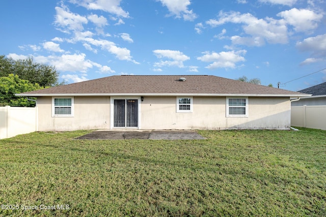 rear view of property featuring a fenced backyard, a patio, stucco siding, and a yard