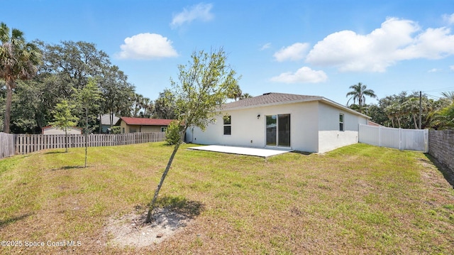 6878 Hartford Rd, Cocoa, FL 32927 - back of property with stucco siding and a patio area