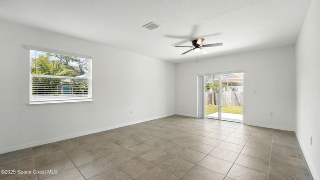 6878 Hartford Rd, Cocoa, FL 32927 - unfurnished room with a ceiling fan, tile patterned flooring, and baseboards