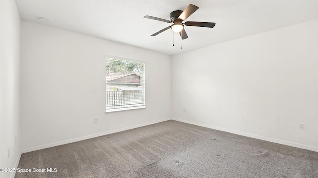 6878 Hartford Rd, Cocoa, FL 32927 - spare room with carpet floors, a ceiling fan, baseboards, and a smoke detector