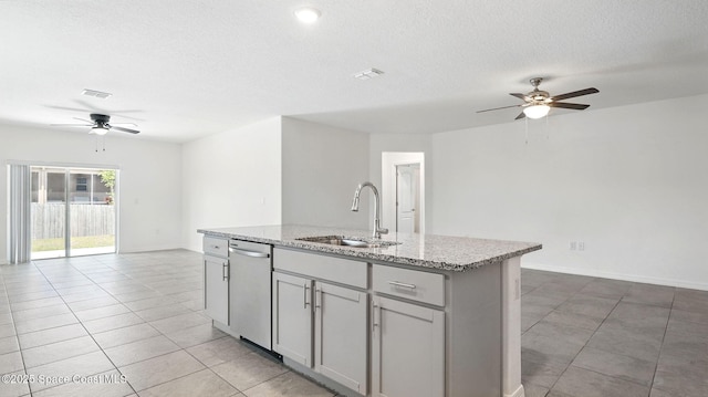 6878 Hartford Rd, Cocoa, FL 32927 - kitchen featuring a sink, a ceiling fan, stainless steel dishwasher, open floor plan, and light tile patterned floors