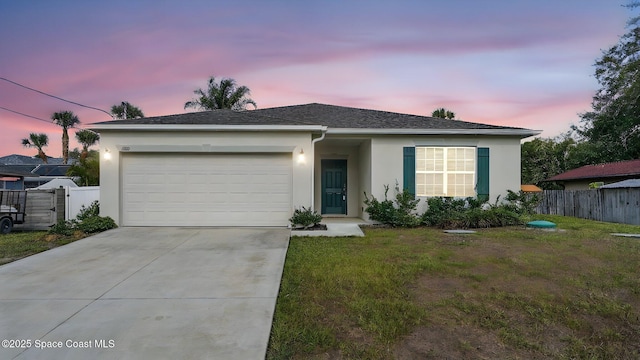 6878 Hartford Rd, Cocoa, FL 32927 - view of front of house featuring stucco siding, an attached garage, and concrete driveway