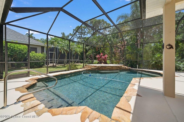 swimming pool featuring a patio area and glass enclosure