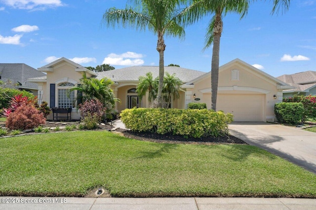 1019 Worthington Spring Dr, Melbourne, FL 32940 - view of front of home with stucco siding, a front lawn, a garage, and driveway