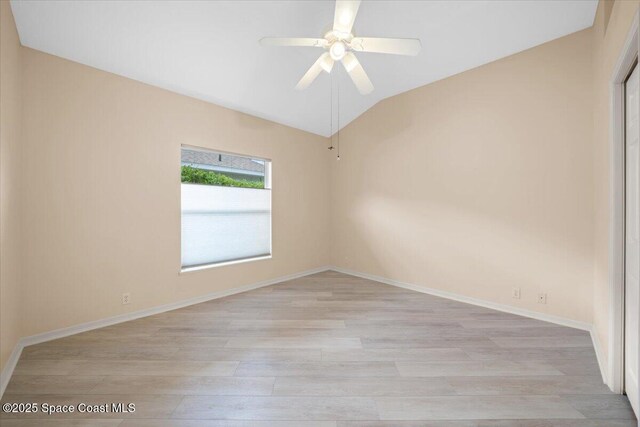 1019 Worthington Spring Dr, Melbourne, FL 32940 - spare room with light wood finished floors, lofted ceiling, a ceiling fan, and baseboards