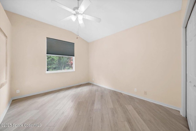 1019 Worthington Spring Dr, Melbourne, FL 32940 - unfurnished bedroom featuring light wood-style flooring, lofted ceiling, a closet, a ceiling fan, and baseboards