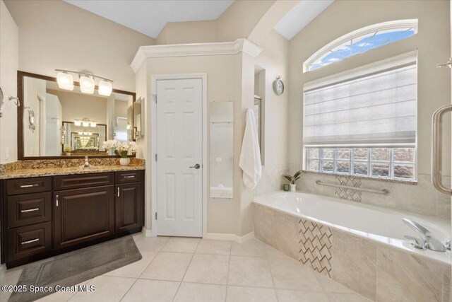 1019 Worthington Spring Dr, Melbourne, FL 32940 - bathroom with a bath, healthy amount of natural light, tile patterned floors, and vanity
