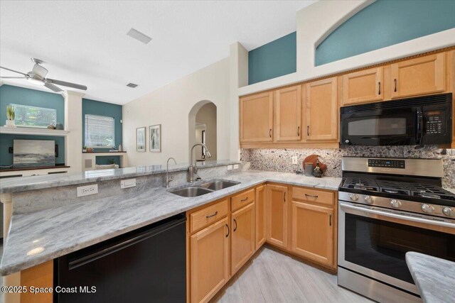 1019 Worthington Spring Dr, Melbourne, FL 32940 - kitchen with black appliances, a sink, light stone countertops, and tasteful backsplash