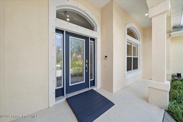 1019 Worthington Spring Dr, Melbourne, FL 32940 - view of exterior entry featuring stucco siding