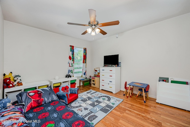 bedroom featuring a ceiling fan and light wood-style flooring