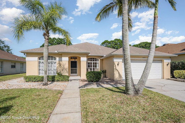 view of front facade featuring a garage, stucco siding, a front yard, and concrete driveway
