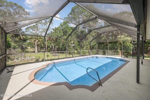 outdoor pool with a patio area