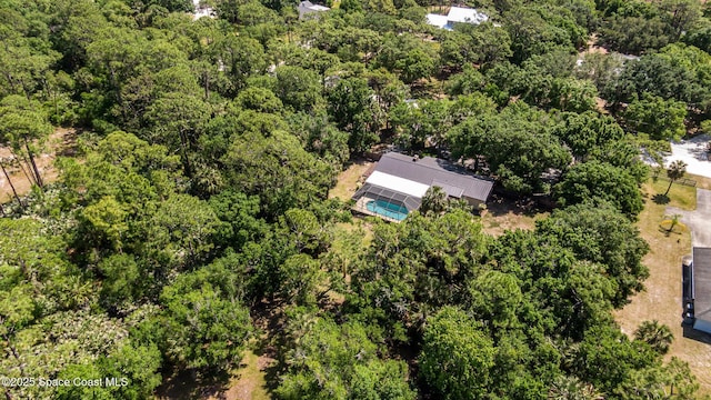 drone / aerial view with a view of trees