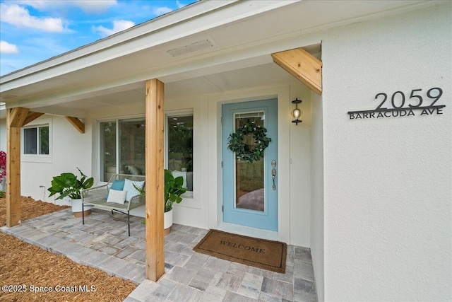 2059 Barracuda Ave, Melbourne Beach, FL 32951 - entrance to property featuring stucco siding