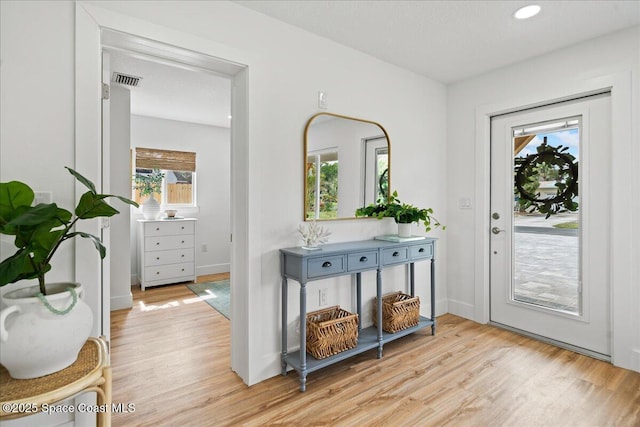 2059 Barracuda Ave, Melbourne Beach, FL 32951 - entryway featuring recessed lighting, baseboards, visible vents, and light wood-style flooring