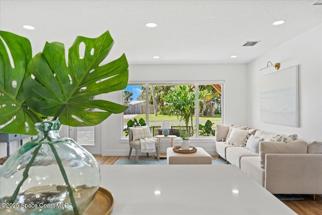 2059 Barracuda Ave, Melbourne Beach, FL 32951 - living area with visible vents, recessed lighting, and wood finished floors