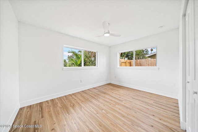 2059 Barracuda Ave, Melbourne Beach, FL 32951 - unfurnished room with baseboards, a ceiling fan, and light wood-type flooring