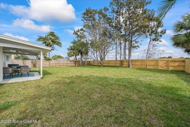 2059 Barracuda Ave, Melbourne Beach, FL 32951 - view of yard featuring a fenced backyard, an outdoor living space, and a patio area