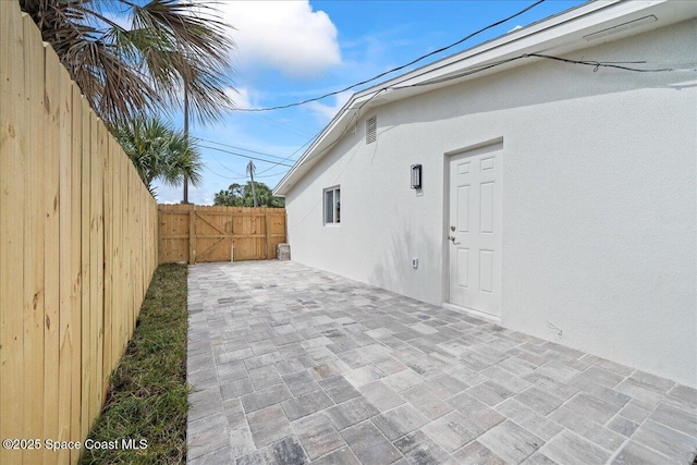 2059 Barracuda Ave, Melbourne Beach, FL 32951 - view of patio featuring fence and a gate