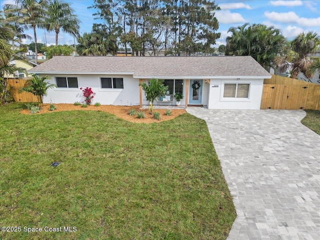 2059 Barracuda Ave, Melbourne Beach, FL 32951 - single story home with fence, stucco siding, and a front lawn