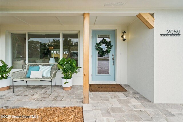 2059 Barracuda Ave, Melbourne Beach, FL 32951 - property entrance with stucco siding